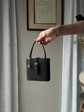 Load image into Gallery viewer, Vintage Parisian Black Box Belt Handbag with French Gold Tone Eiffel Tower Charm Sourced from France Black Gold Tassel Fringe