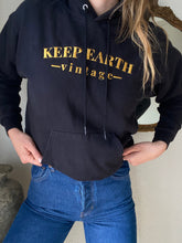 Load image into Gallery viewer, Upcycled Vintage Black Hoodie Sweatshirt Gold Keep Earth Vintage Logo

