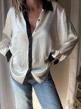 Load image into Gallery viewer, Vintage Deadstock Silk Ivory White Satin Oversized Button Up Blouse Black Collar and Sleeve Cuffs
