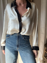 Load image into Gallery viewer, Vintage Deadstock Silk Ivory White Satin Oversized Button Up Blouse Black Collar and Sleeve Cuffs
