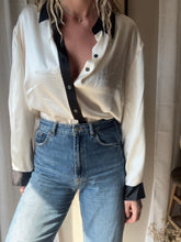 Load image into Gallery viewer, Vintage Deadstock Silk Ivory White Satin Oversized Button Up Blouse Black Collar and Sleeve Cuffs
