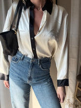 Load image into Gallery viewer, Vintage Deadstock Silk Ivory White Satin Oversized Button Up Blouse Black Collar and Sleeve Cuffs
