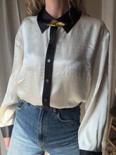 Load image into Gallery viewer, Vintage Deadstock Silk Ivory White Satin Oversized Button Up Blouse Black Collar and Sleeve Cuffs
